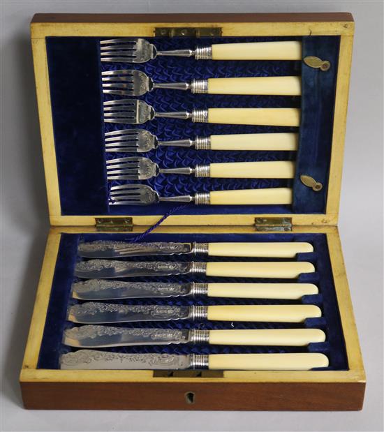 A cased set of six pairs of Edwardian ivory handled silver fish eaters, Sheffield, 1902.